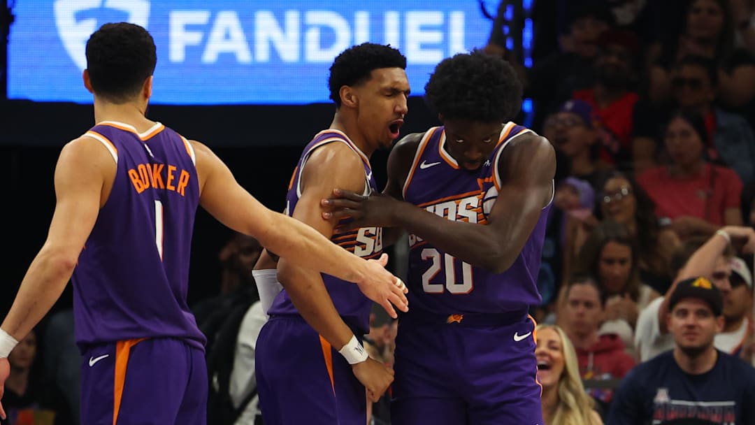 Mar 22, 2026; Phoenix, Arizona, USA; Phoenix Suns forward Rasheer Fleming (20) and forward Ryan Dunn (0) celebrate after a layup against the Toronto Raptors in the first quarter at Mortgage Matchup Center. Mandatory Credit: Anna Carrington-Imagn Images