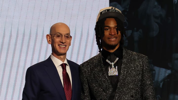 Jun 26, 2024; Brooklyn, NY, USA; Stephon Castle poses for photos with NBA commissioner Adam Silver after being selected in the first round by the San Antonio Spurs in the 2024 NBA Draft at Barclays Center.