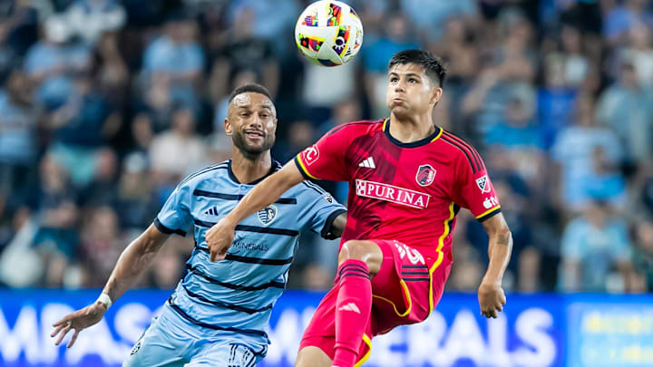 St. Louis CITY SC defender Anthony Markanich (13) controls the ball against Sporting Kansas City forward Khiry Shelton (11) in the second half at Children's Mercy Park