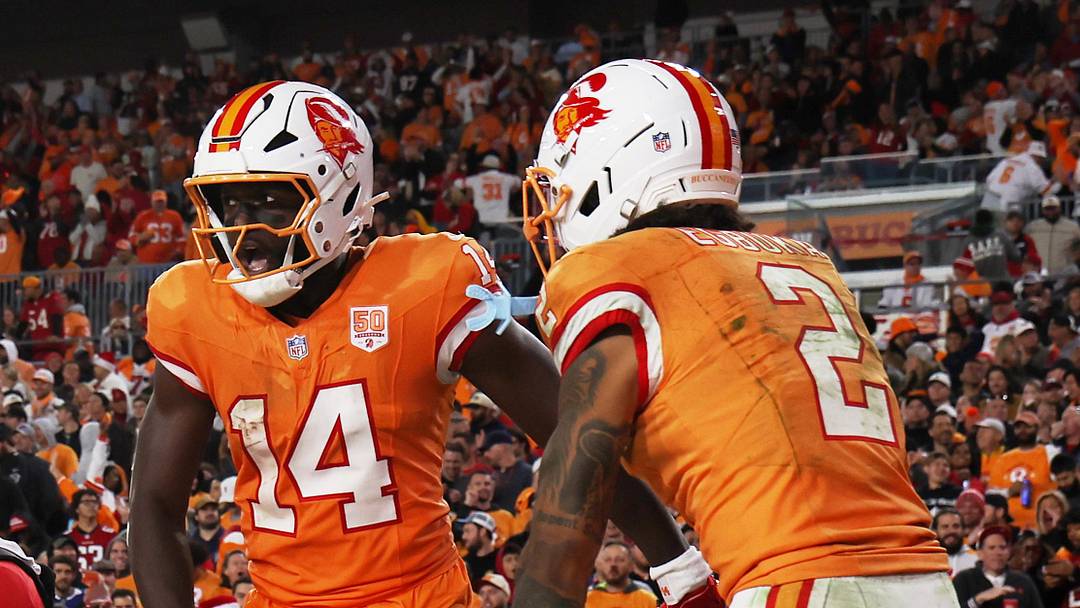 Tampa Bay Buccaneers wide receiver Chris Godwin Jr. (14) celebrates with wide receiver Emeka Egbuka