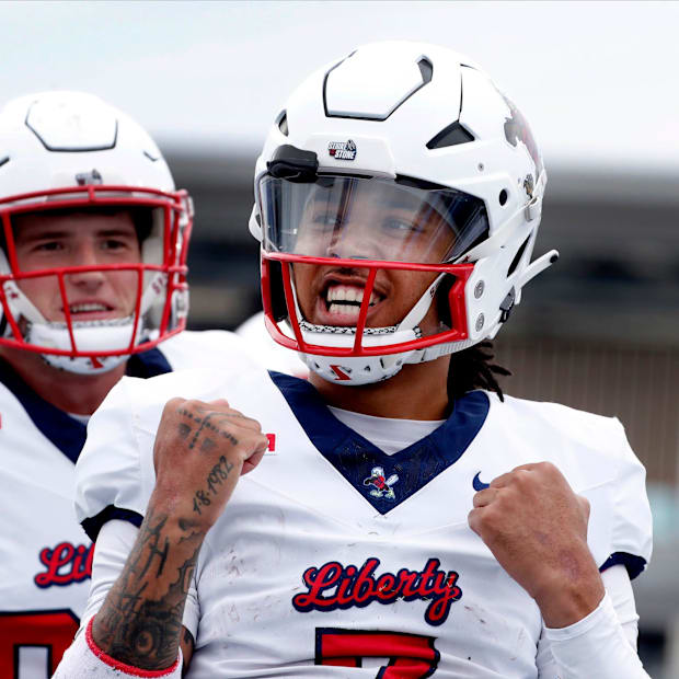 Liberty quarterback Kaidon Salter (7) celebrates his touchdown against Middle Tennessee during the Salute to Veterans & A