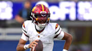 Oct 5, 2025; Inglewood, California, USA; Washington Commanders quarterback Jayden Daniels (5) runs against the Los Angeles Chargers in the second half at SoFi Stadium. Mandatory Credit: Gary A. Vasquez-Imagn Images
