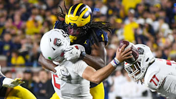 Jaishawn Barham #1 of the Michigan Wolverines sacks Jack Layne #2 of the New Mexico Lobos during the second half of a college football game at Michigan Stadium on August 30, 2025 in Ann Arbor, Michigan. The call was later changed to a targeting personal foul. The Michigan Wolverines won the game 34-17.
