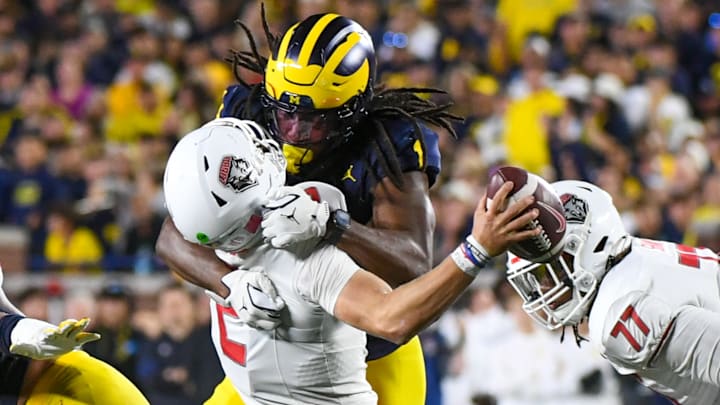 Jaishawn Barham #1 of the Michigan Wolverines sacks Jack Layne #2 of the New Mexico Lobos during the second half of a college football game at Michigan Stadium on August 30, 2025 in Ann Arbor, Michigan. The call was later changed to a targeting personal foul. The Michigan Wolverines won the game 34-17.