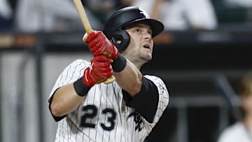 Former Arkansas Razorback turned Chicago White Sox left fielder Andrew Benintendi (23) eyes a solo home run against the Kansas City Royals during the fourth inning at Rate Field on August 27.