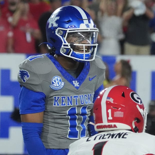 Kentucky DB Zion Childress celebrates tackling Georgia’s Trevor Etienne Saturday night at Kroger Field.