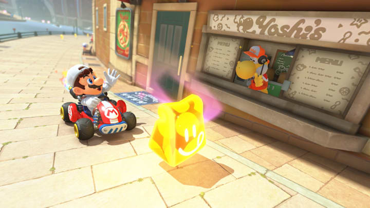 Mario picking up a take-out bag from Yoshi's as he drives past.