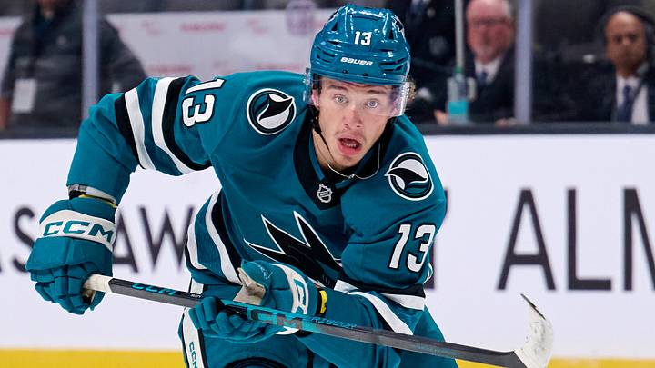 Sep 21, 2025; San Jose, California, USA; San Jose Sharks left wing Quentin Musty (13) skates toward the puck against the Vegas Golden Knights during the second period at SAP Center at San Jose. Mandatory Credit: Robert Edwards-Imagn Images