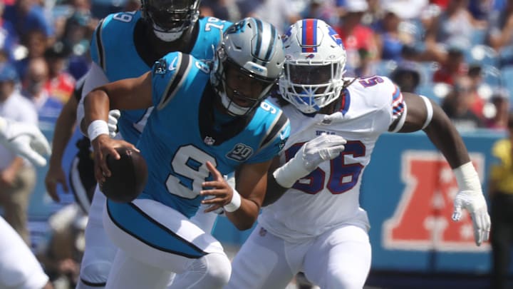 Panthers quarterback Bryce Young gets chased down by Bills Javon Solomon during the first half of the preseason game against Carolina Panthers at Highmark Stadium in Orchard Park on Aug. 24, 2024.