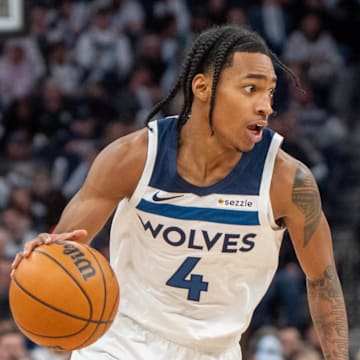 Feb 8, 2025; Minneapolis, Minnesota, USA; Minnesota Timberwolves guard Rob Dillingham (4) dribbles against the Portland Trail Blazers in the third quarter at Target Center. Mandatory Credit: Matt Blewett-Imagn Images