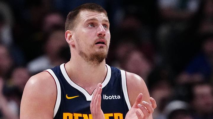 Mar 28, 2025; Denver, Colorado, USA; Denver Nuggets center Nikola Jokic (15) reacts in the third quarter against the Utah Jazz at Ball Arena. Mandatory Credit: Ron Chenoy-Imagn Images