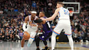 Nov 7, 2025; Sacramento, California, USA; Oklahoma City Thunder guard Shai Gilgeous-Alexander (2) dribbles past Sacramento Kings guard Russell Westbrook (18) in the third quarter at the Golden 1 Center. Mandatory Credit: Cary Edmondson-Imagn Images