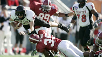Jan 1, 2006; Dallas, Texas USA;  Texas Tech Red Raiders quarterback (10) Cody Hodges is tackled by Alabama Crimson Tide linebacker(35) MeMeco Ryans at the Cotton Bowl in Dallas Texas. Mandatory Credit: Photo by Tim Heitman-Imagn Images (c) Copyright 2006 Tim Heitman
