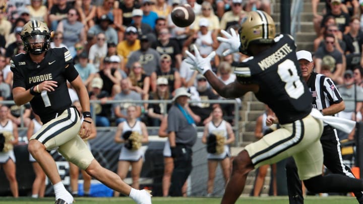 Purdue Boilermakers quarterback Hudson Card (1) passes the ball to Purdue Boilermakers wide receiver De'Nylon Morrissette (8)