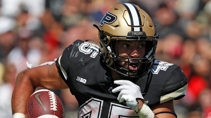 Purdue Boilermakers running back Devin Mockobee (45) rushes the ball Purdue Boilermakers running back Devin Mockobee (45) rushes the ball