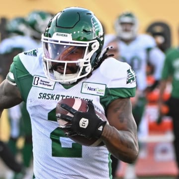 Jun 16, 2024; Hamilton, Ontario, CAN; Saskatchewan Rough Riders wide receiver Mario Alford (2) carries the ball in the first quarter against the Hamilton Tiger Cats at Tim Hortons Field. Mandatory Credit: Gerry Angus-USA TODAY Sports