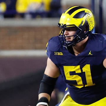Nov 23, 2024; Ann Arbor, Michigan, USA;  Michigan Wolverines offensive lineman Greg Crippen (51) blocks against the Northwestern Wildcats at Michigan Stadium. Mandatory Credit: Rick Osentoski-Imagn Images