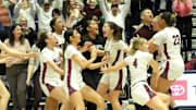 The Tualatin girls basketball team celebrates the first OSAA Class 6A state championship in program history.