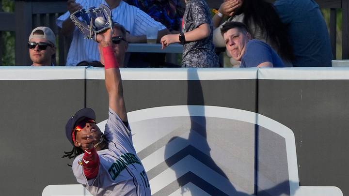 Cedar Rapids Kernels Yasser Mercedes (17) makes a leaping catch in right field to prevent a homerun by the Wisconsin Timber Rattlers during their baseball game Tuesday, June 23, 2026, at Neuroscience Group Field at Fox Cities Stadium in Grand Chute, Wisconsin. The Rattlers won 5-0.