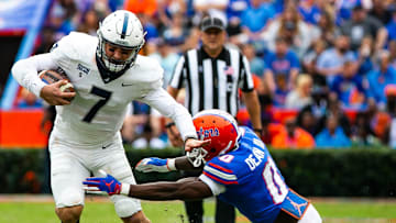 Florida Gators safety Trey Dean III (0) tackles Samford Bulldogs quarterback Liam Welch (7). The Florida Gators hosted the Samford Bulldogs at  Ben Hill Griffin Stadium Saturday afternoon, November 13, 2021 in Gainesville, FL. during the first half of action.  [Doug Engle/Ocala Star-Banner]2021

Flgai Ufvs Samford Football
