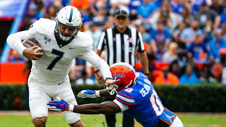 Florida Gators safety Trey Dean III (0) tackles Samford Bulldogs quarterback Liam Welch (7). The Florida Gators hosted the Samford Bulldogs at  Ben Hill Griffin Stadium Saturday afternoon, November 13, 2021 in Gainesville, FL. during the first half of action.  [Doug Engle/Ocala Star-Banner]2021

Flgai Ufvs Samford Football