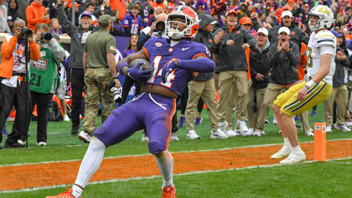 Nov 11, 2023; Clemson, South Carolina, USA; Clemson Tigers cornerback Shelton Lewis (14) returns an interception for a touchdown against the Georgia Tech Yellow Jackets during the fourth quarter at Memorial Stadium. Mandatory Credit: Ken Ruinard-USA TODAY Sports