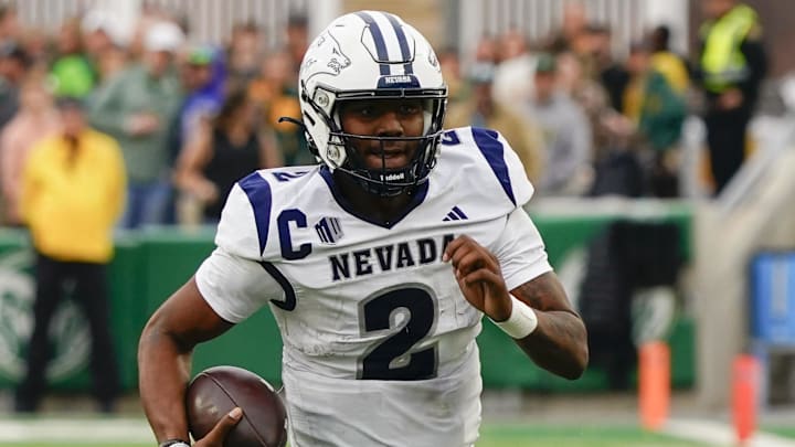 Nov 18, 2023; Fort Collins, Colorado, USA;  Nevada Wolf Pack quarterback Brendon Lewis (2) runs for a gain against the Colorado State Rams at Sonny Lubick Field at Canvas Stadium. Mandatory Credit: Michael Madrid-Imagn Images