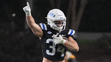 Nov 29, 2025; Durham, North Carolina, USA;  Duke Blue Devils linebacker Luke Mergott (34) reacts after recovering a fumble against the Wake Forest Demon Deacons during the fourth quarter at Wallace Wade Stadium. Mandatory Credit: Zachary Taft-Imagn Images