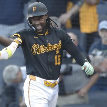 Pittsburgh Pirates center fielder Oneil Cruz (15) celebrates his solo home run with designated hitter Andrew McCutchen (22) against the Miami Marlins during the first inning at PNC Park. 