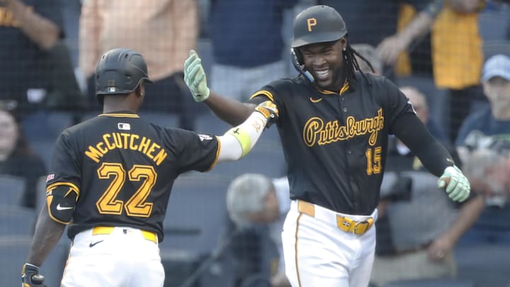 Pittsburgh Pirates center fielder Oneil Cruz (15) celebrates his solo home run with designated hitter Andrew McCutchen (22) against the Miami Marlins during the first inning at PNC Park. 