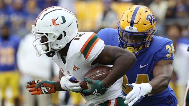 Oct 30, 2021; Pittsburgh, Pennsylvania, USA; Miami Hurricanes wide receiver Brashard Smith (12) returns a kick-off against Pittsburgh Panthers linebacker Solomon DeShields (34) during the third quarter at Heinz Field. Mandatory Credit: Charles LeClaire-Imagn Images Oct 30, 2021; Pittsburgh, Pennsylvania, USA; Miami Hurricanes wide receiver Brashard Smith (12) returns a kick-off against Pittsburgh Panthers linebacker Solomon DeShields (34) during the third quarter at Heinz Field. Mandatory Credit: Charles LeClaire-Imagn Images