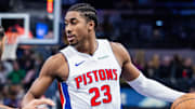 Nov 29, 2024; Indianapolis, Indiana, USA; Detroit Pistons guard Jaden Ivey (23) dribbles the ball while Indiana Pacers forward Obi Toppin (1) defends in the second half  at Gainbridge Fieldhouse. Mandatory Credit: Trevor Ruszkowski-Imagn Images