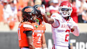 Arkansas Razorbacks wide receiver Andrew Armstrong motions first down against the Oklahoma State Cowboys.