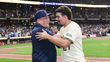 Sep 18, 2024; Milwaukee, Wisconsin, USA;  Milwaukee Brewers manager Pat Murphy and shortstop Willy Adames (27) celebrate after beating the Philadelphia Phillies and winning the NL Central Division at American Family Field. Mandatory Credit: Benny Sieu-Imagn Images