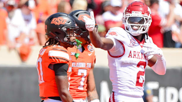 Razorbacks wide receiver Andrew Armstrong motions first down against Oklahoma State.