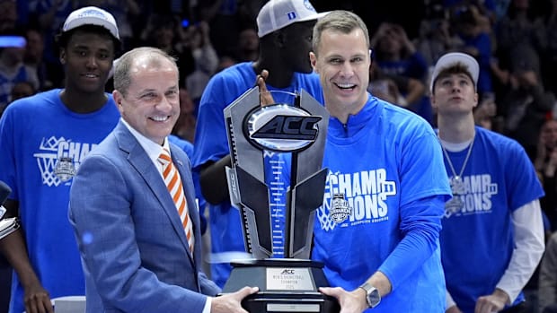 Jon Scheyer gets the ACC Tournament trophy after Duke beat Louisville to capture it in Marc