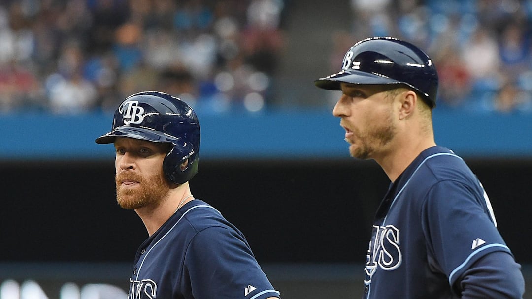 Tampa Bay Rays second baseman Logan Forsythe (11) waits with first base coach Rocco Baldelli (15) for a review of a call during play against Toronto Blue Jays at Rogers Centre on July 17, 2015. Tampa Bay Rays second baseman Logan Forsythe (11) waits with first base coach Rocco Baldelli (15) for a review of a call during play against Toronto Blue Jays at Rogers Centre on July 17, 2015.