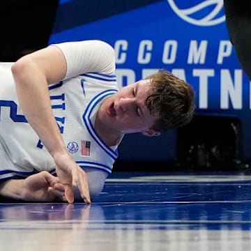 Mar 13, 2025; Charlotte, NC, USA; Duke Blue Devils forward Cooper Flagg (2) is injured in the first half at Spectrum Center. Mandatory Credit: Bob Donnan-Imagn Images
