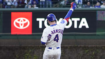 Apr 27, 2025; Chicago, Illinois, USA; Chicago Cubs outfielder Pete Crow-Armstrong (4) gestures after hitting a one-run double against the Philadelphia Phillies during the second inning at Wrigley Field. 