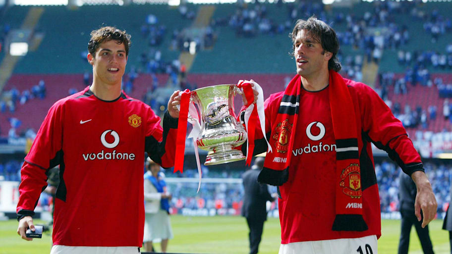 Cristiano Ronaldo and Ruud van Nistelrooy lift the FA Cup in 2004.