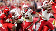 Nebraska Qquarterback Dylan Raiola looks for a receiver while avoiding the Cincinnati pass rush in Kansas City.