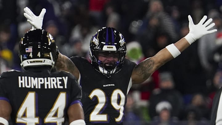 Dec 21, 2025; Baltimore, Maryland, USA;  Baltimore Ravens safety Ar'Darius Washington (29) celebrates forcing a fumble by New England Patriots quarterback Drake Maye (not pictured) during the first half of the game at M&T Bank Stadium. Mandatory Credit: James Lang-Imagn Images