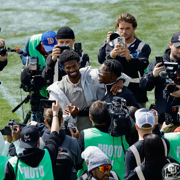Apr 19, 2025; Boulder, CO, USA; Former Colorado Buffaloes players Shedeur Sanders (L) and Travis Hunter (R) during their numb
