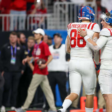 Dec 30, 2023; Atlanta, GA, USA; Mississippi Rebels tight end Caden Prieskorn (86) and quarterback Jaxson Dart (2) celebrate after a two-point conversion against the Penn State Nittany Lions in the second half at Mercedes-Benz Stadium. Mandatory Credit: Brett Davis-USA TODAY Sports