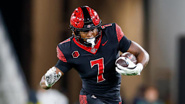 Oct 3, 2025; San Diego, California, USA; San Diego State Aztecs running back Lucky Sutton (7) runs the ball during the second half against the Colorado State Rams at Snapdragon Stadium.