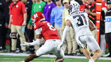 Oct 18, 2025; Piscataway, New Jersey, USA;  Rutgers Scarlet Knights wide receiver Kj Duff (8) makes a catch during the second half in front of Oregon Ducks defensive back Dillon Thieneman (31) at SHI Stadium. Mandatory Credit: Vincent Carchietta-Imagn Images