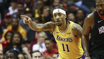 Jan 19, 2019; Houston, TX, USA; Los Angeles Lakers forward Michael Beasley (11) and Houston Rockets center Nene Hilario (42) react after Beasley scores a basket during the second quarter at Toyota Center. Mandatory Credit: Troy Taormina-Imagn Images