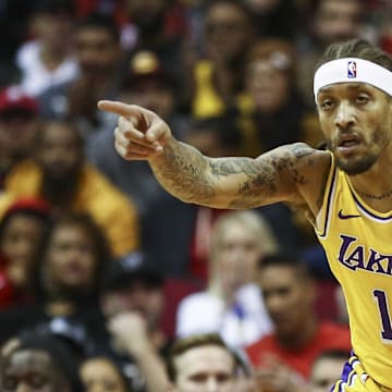 Jan 19, 2019; Houston, TX, USA; Los Angeles Lakers forward Michael Beasley (11) and Houston Rockets center Nene Hilario (42) react after Beasley scores a basket during the second quarter at Toyota Center. Mandatory Credit: Troy Taormina-Imagn Images