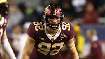 Dec 28, 2021; Phoenix, AZ, USA; Minnesota Golden Gophers defensive lineman Danny Striggow (92) against the West Virginia Mountaineers in the Guaranteed Rate Bowl at Chase Field. Mandatory Credit: Mark J. Rebilas-Imagn Images