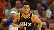 Apr 25, 2023; Phoenix, Arizona, USA; Phoenix Suns guards Devin Booker (1) smiles after a shot against the Los Angeles Clippers during the first half in game five of the 2023 NBA playoffs at Footprint Center. Mandatory Credit: Mark J. Rebilas-Imagn Images
